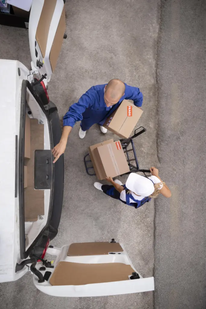 Full Shot Delivery People Holding Box 683x1024
